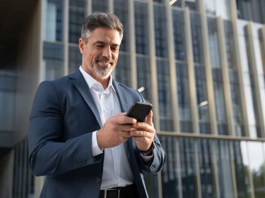 Buisness man in suit looking at phone