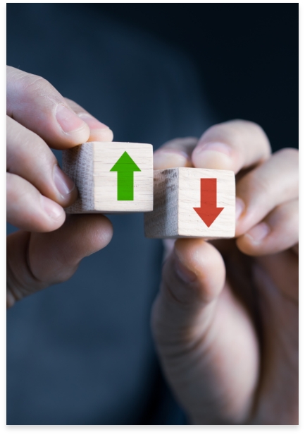 two dice with arrows pointing up and down