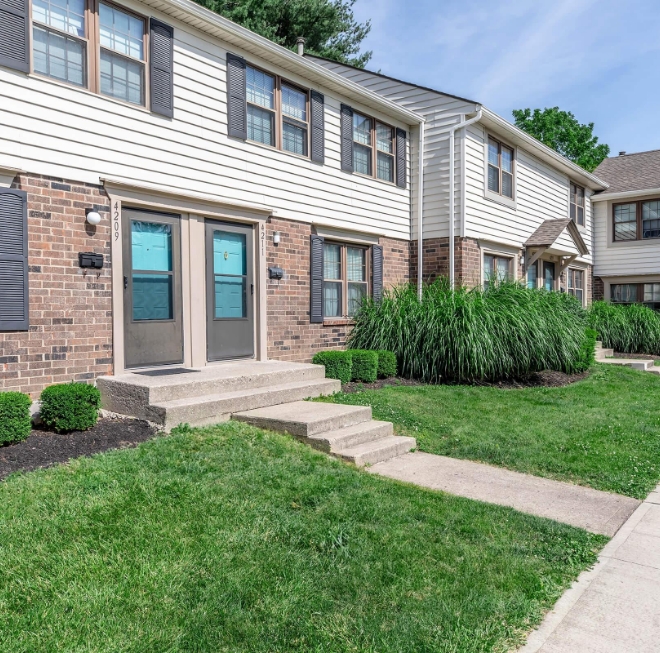 Apartment exterior with green grass