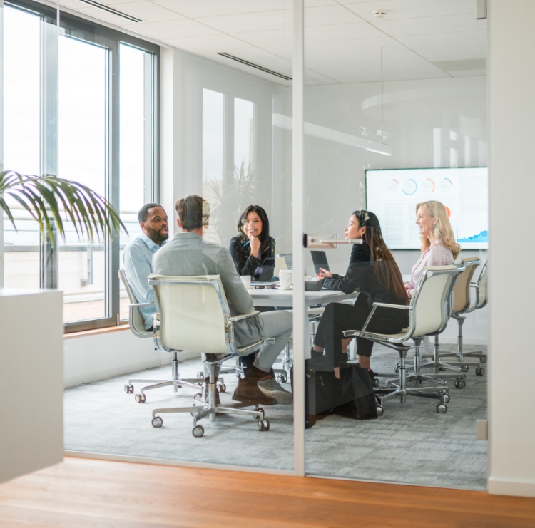 coworkers sitting at a table for a meeting